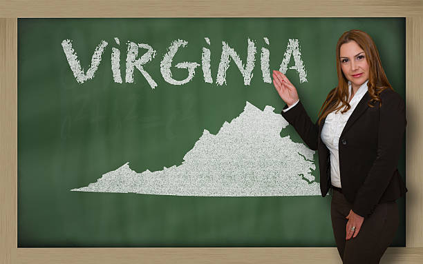 istock Teacher showing map of virginia on blackboard 179033089