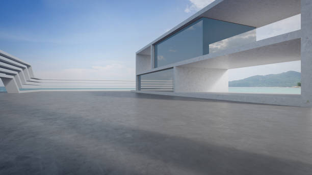 istock Abstract architecture design of modern building. Empty parking area concrete floor with beach and blue sky sea view. 1790342393