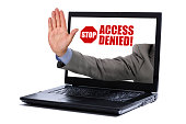 Laptop showing a man's hand reading access denied