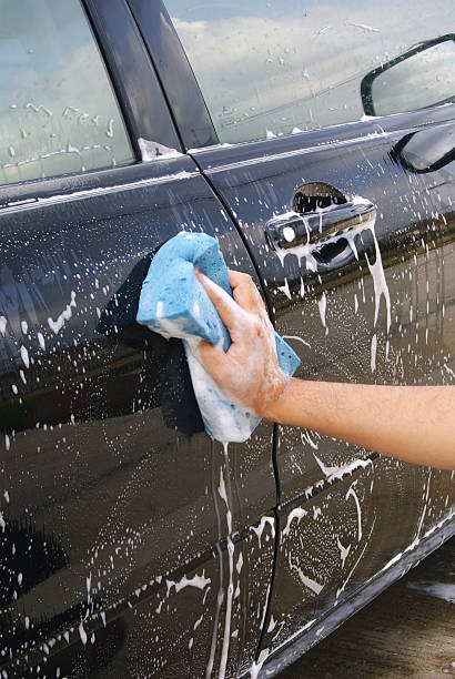 istock Hand washing a black car 179036450