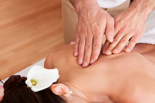 istock Beautiful young woman getting back massage 179036848