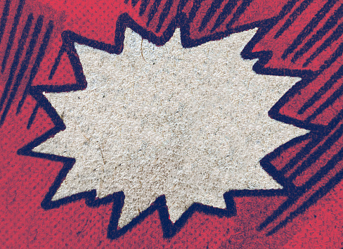 Closeup of real vintage comic book page with empty white speech bubble on a background texture of colorful red and blue printing dots