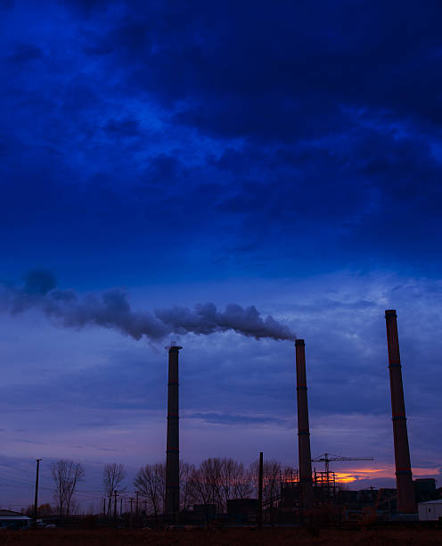istock Heavy smoke spewed from coal powered plant 179037521