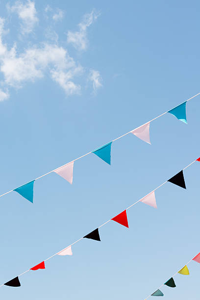 istock Colorful flags against blue sky (XXXLarge) 179037960