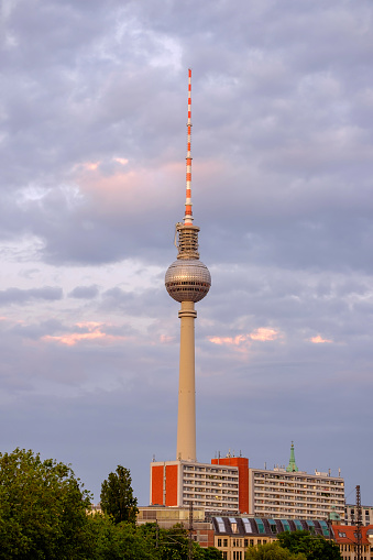 Berlin TV tower on sunset with beautiful clouds behind.