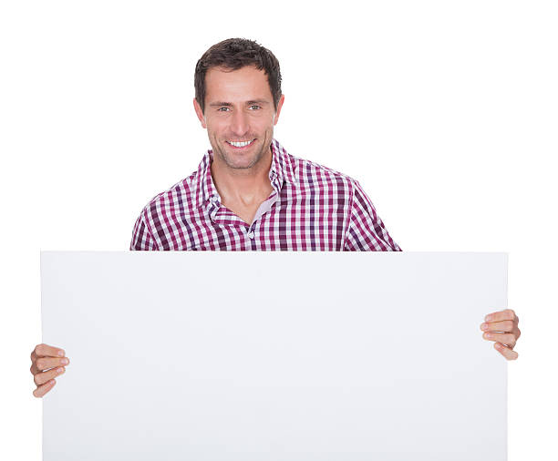 istock Portrait Of Young Man Holding Placard 179039199