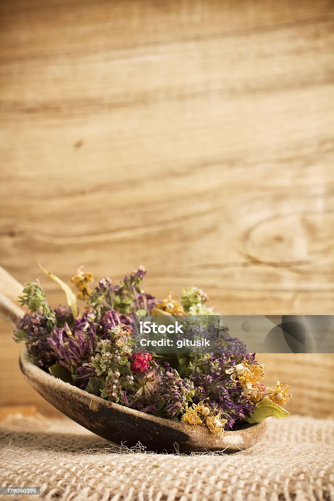 Herbal tea. Dry herbal tea and the wooden spoon. Camellia sinensis Stock Photo