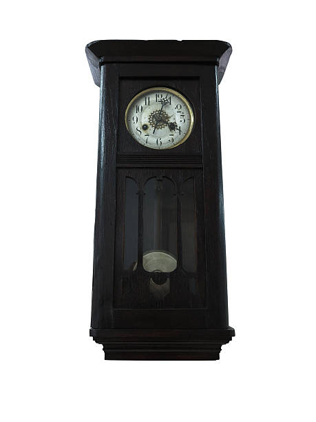 istock 19th Century old pendulum wooden clock isolated on white 179040638