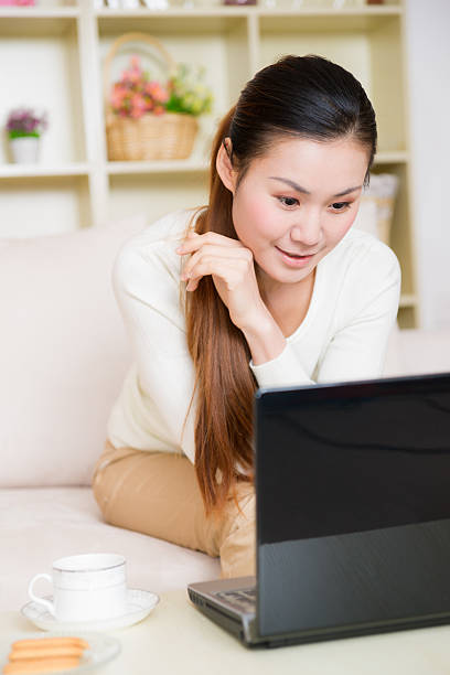 istock young asian woman using a laptop 179040849