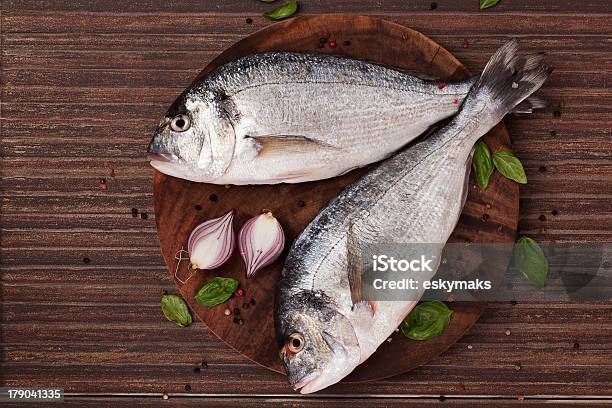 Fresh Fish On Chopping Board Stock Photo - Download Image Now - Above, Animal, Barbecue - Meal