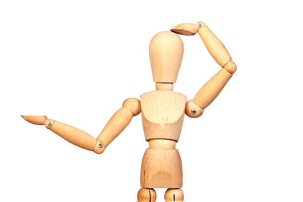 istock Jointed wooden mannequin looking something 179041468