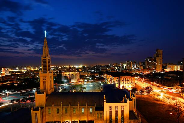 religious maputo skyline of the city of Maputo at night with the church in the foreground mozambique stock pictures, royalty-free photos & images