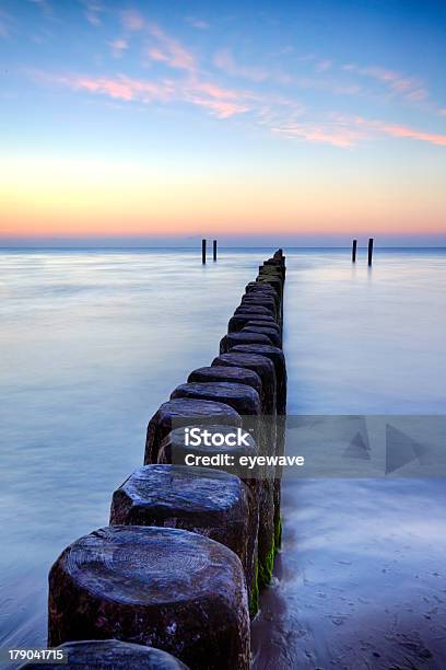 Breakwater At Sunset Baltic Sea Stock Photo - Download Image Now - Baltic Sea, Pole, Beach