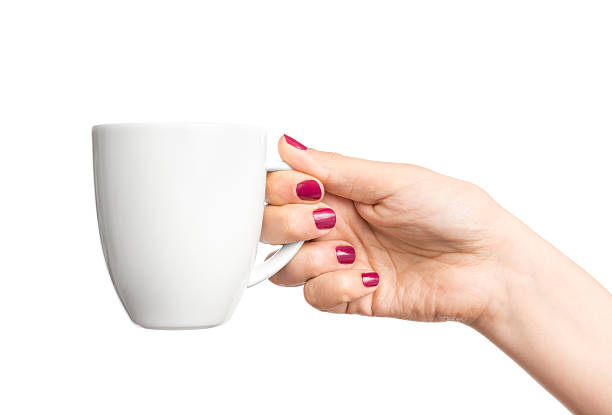 istock White coffee mug in woman's hand with red fingernails 179042159