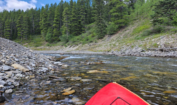 istock Bow of a red kayak floating on a lake 1790421797