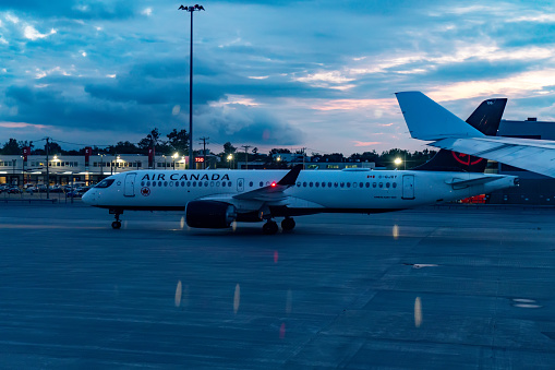 An Air Canada airplane taxiing on the runway of Toronto Pearson International Airport, Canada.