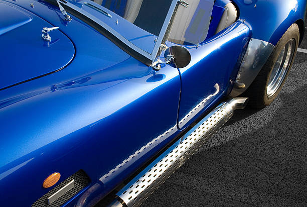 Blue classic American muscle car with chrome side exhaust