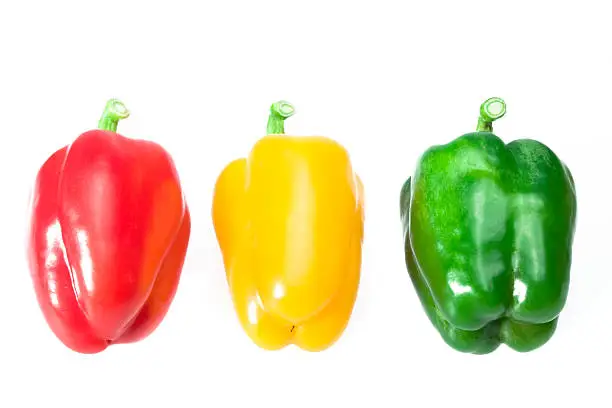 close up of green red and yellow bellpeppers