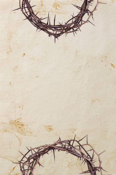 istock Crown of thorns border on textured paper 179048808