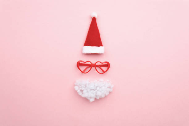 istock Santa hat, beard and glasses on color background top view 1790491515