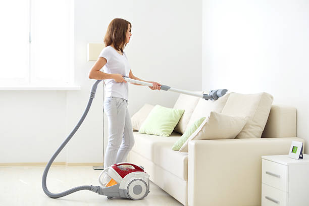 istock Attractive girl with vacuum cleaner 179049649