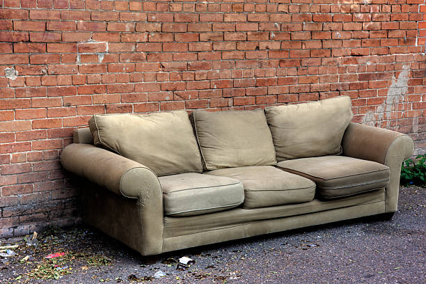 istock old sofa discarded in an alley 179049772