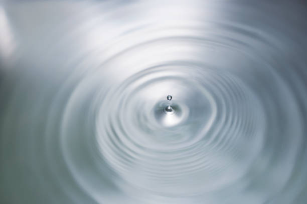 istock Water drop falling into water with ripples and waves. 1790502292