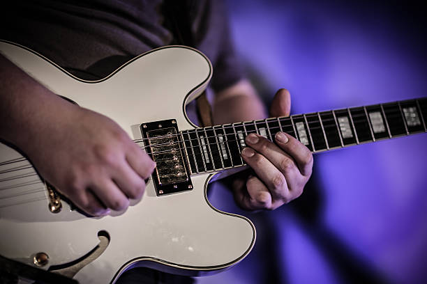 istock Musician playing the guitar in a club 179050587