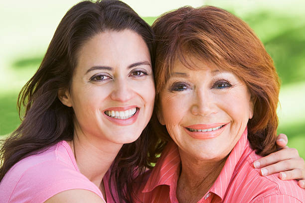 istock Two women standing outdoors smiling 179051586