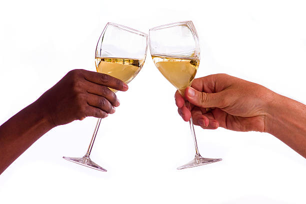 duas pessoas tostar com copos de vinho branco - toast glass cut out human hand imagens e fotografias de stock
