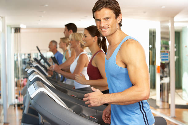 istock Man On Running Machine In Gym 179053035