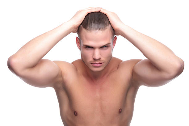 istock topless fashion man with hands on head 179053261