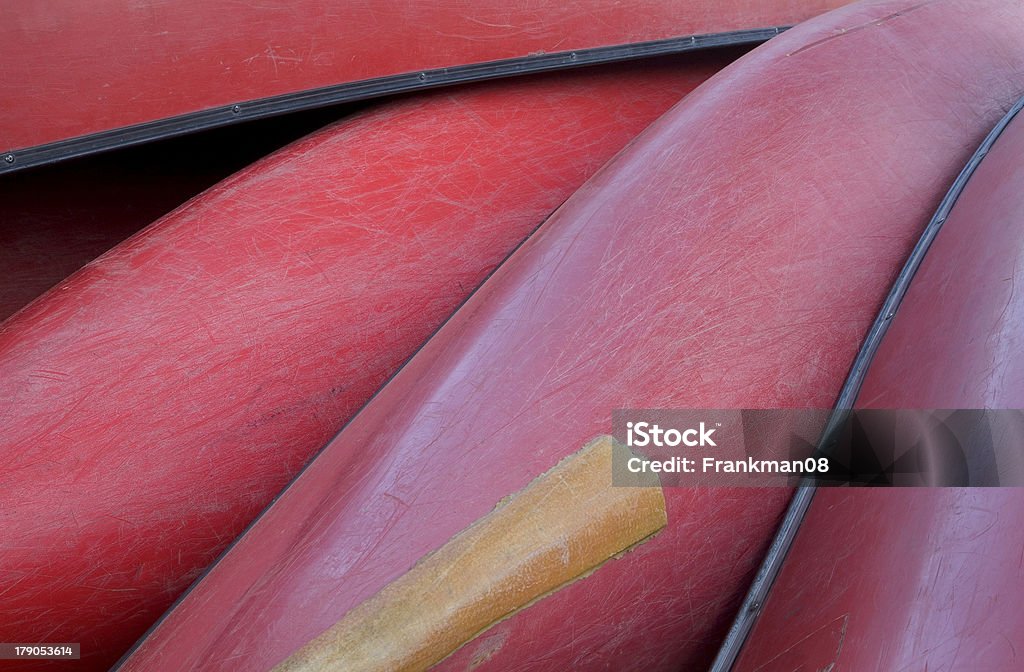 Red canoes "You can find these red boats near the river Lahn in Hessen, Germany. They can be rented for a trip along the river." Aquatic Sport Stock Photo