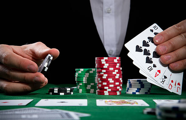 istock Poker player with chips and cards 179054394