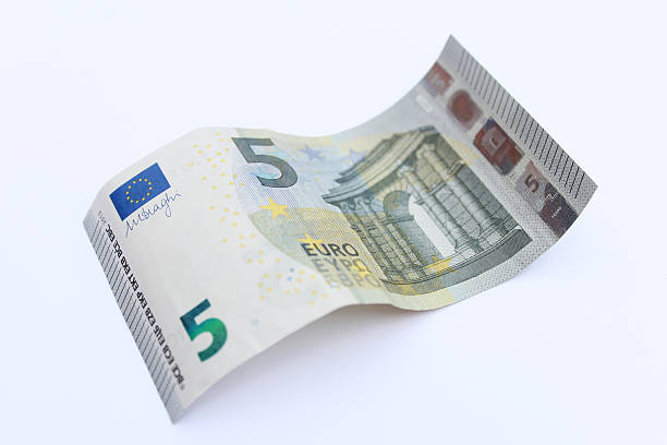 Waved five Euro banknote New five Euro banknote, issued in 2013. five euro banknote photos stock pictures, royalty-free photos & images