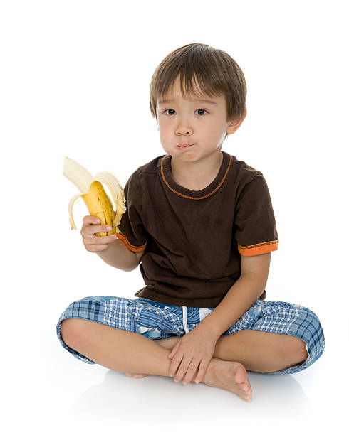 istock Boy Eating a Banana 179055002