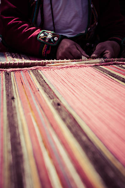 istock Traditional hand weaving in the Andes Mountains, Peru 179055044