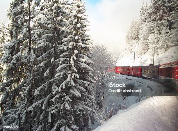 Swiss Train Travelling Through Alps In Winter Stock Photo - Download Image Now - Train - Vehicle, Car, Skiing