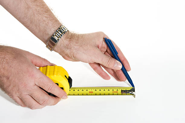 Measurement with measuring tape stock photo