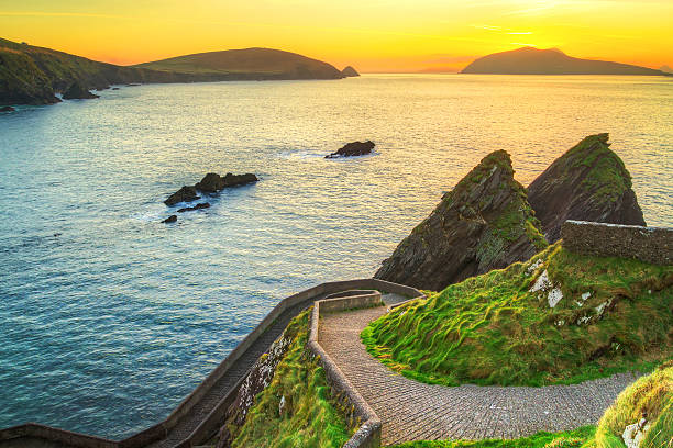 The Dingle Peninsula in Ireland as seen on sunset Sunset over pathway leading to Dunquin Pier on Dingle Peninsula, Co.Kerry, Ireland - HDR dingle peninsula stock pictures, royalty-free photos & images