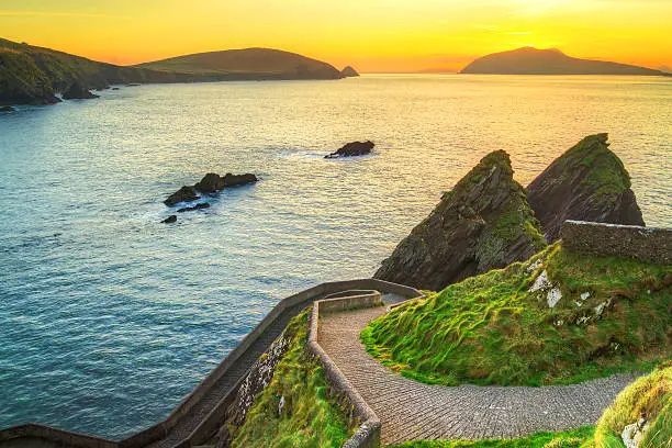 Sunset over pathway leading to Dunquin Pier on Dingle Peninsula, Co.Kerry, Ireland - HDR