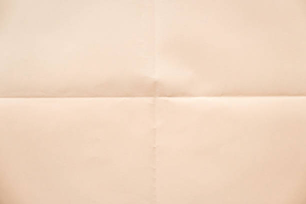 istock Folded peach color paper for background. 1790577575