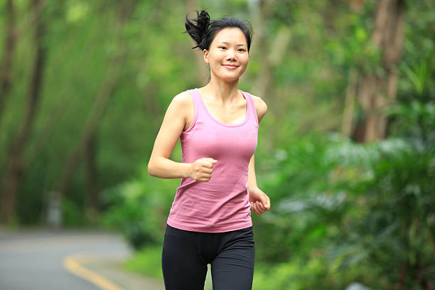 istock young asian woman jogging in forest 179057817