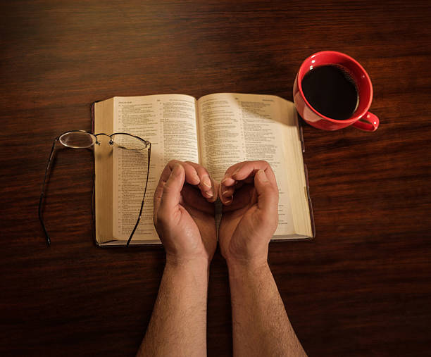 istock Hands With Coffee and Bible 179058011