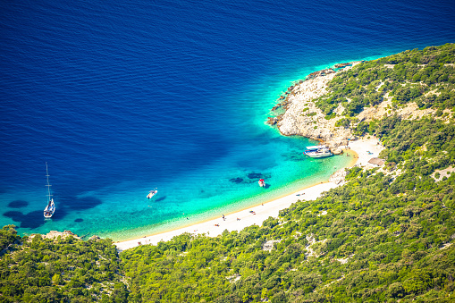 Secret turquoise beach below Lubenice village on Cres island, scenic archipelago of Croatia