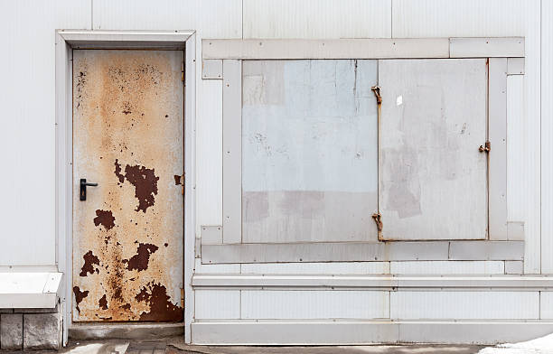 istock Old rusted locked door and windows background texture 179058519