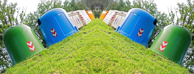 differentiated waste collection on the green lawn panoramic specular photo