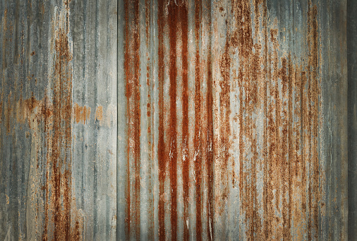 Old zinc wall texture background, rusty on galvanized metal panel sheeting.