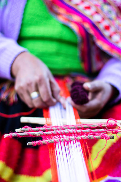 istock Traditional hand weaving in the Andes Mountains, Peru 179059465