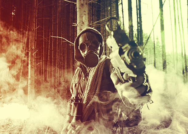 Futuristic nazi soldier gas mask and steel helmet with schmeisser handgun isolated on white studio shot closeup portrait